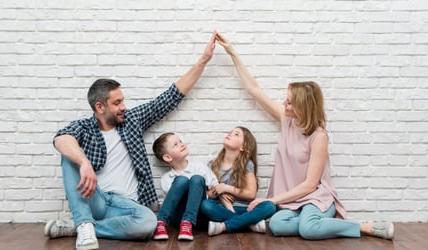 Family celebrating getting a new home in 2024
